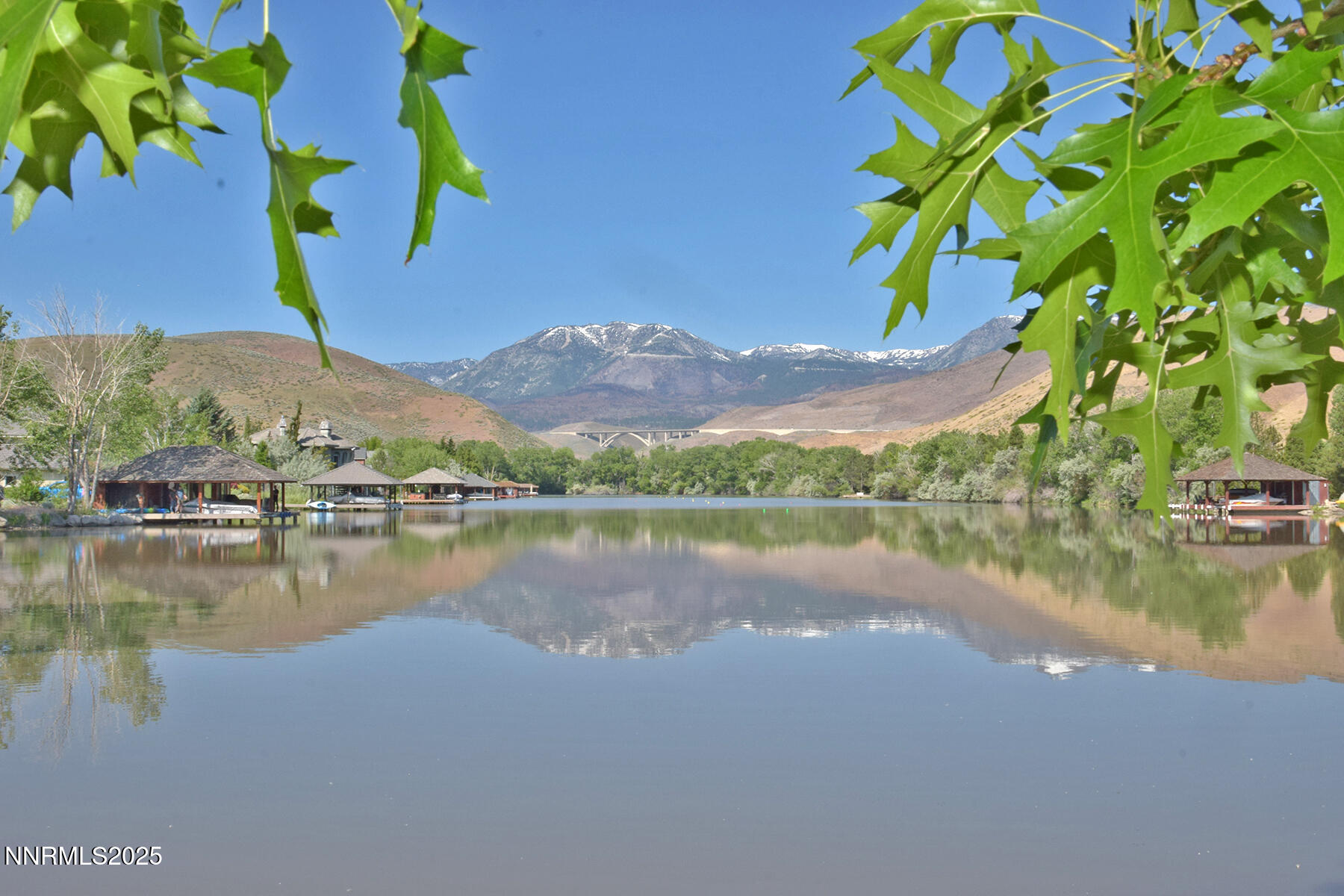 95 Hidden Lake Drive Reno, NV 89521 - Photo 19 of 43 a view of a lake with a mountain in the background
