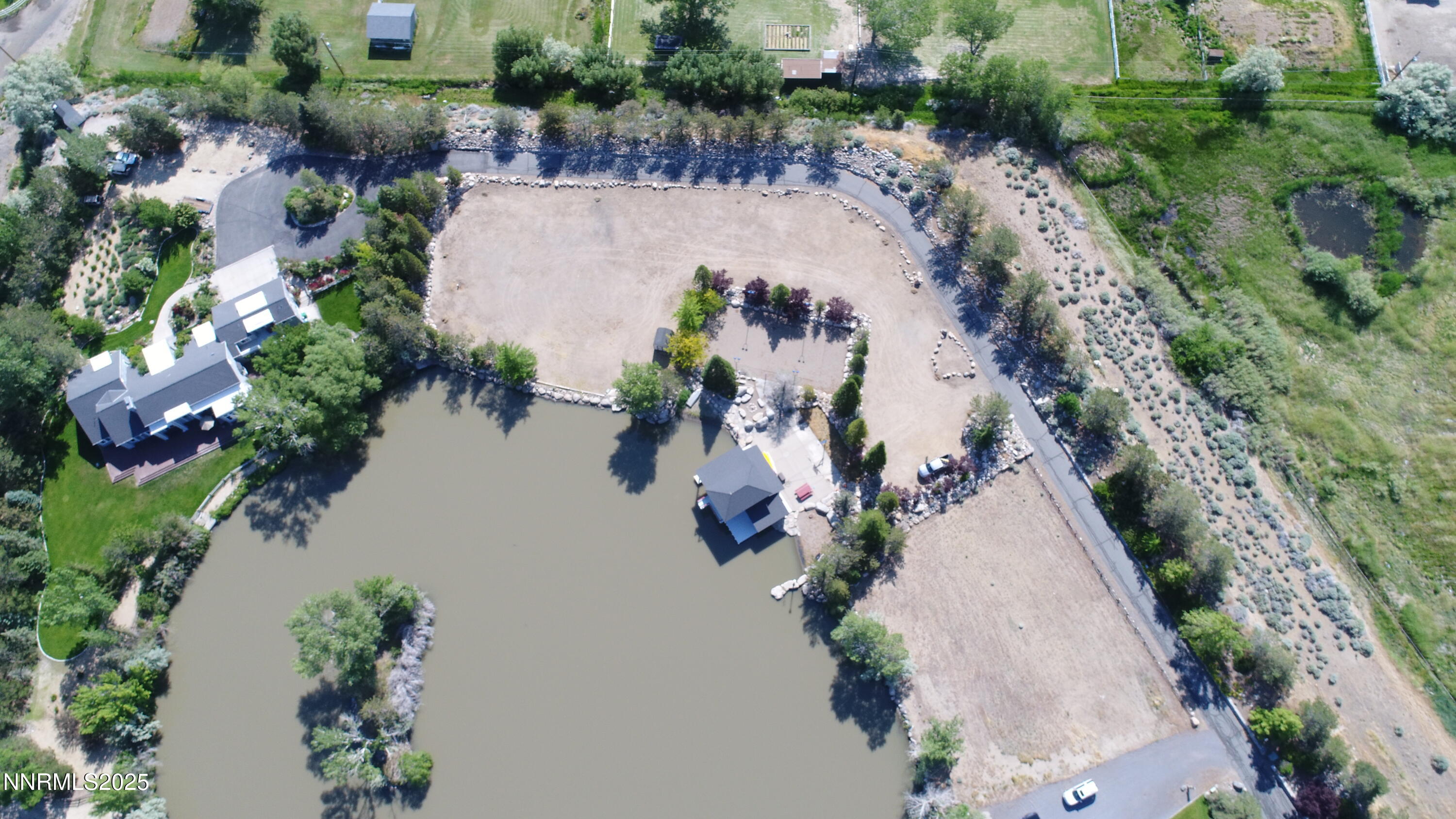95 Hidden Lake Drive Reno, NV 89521 - Photo 28 of 43 an aerial view of a house with a yard and lake view