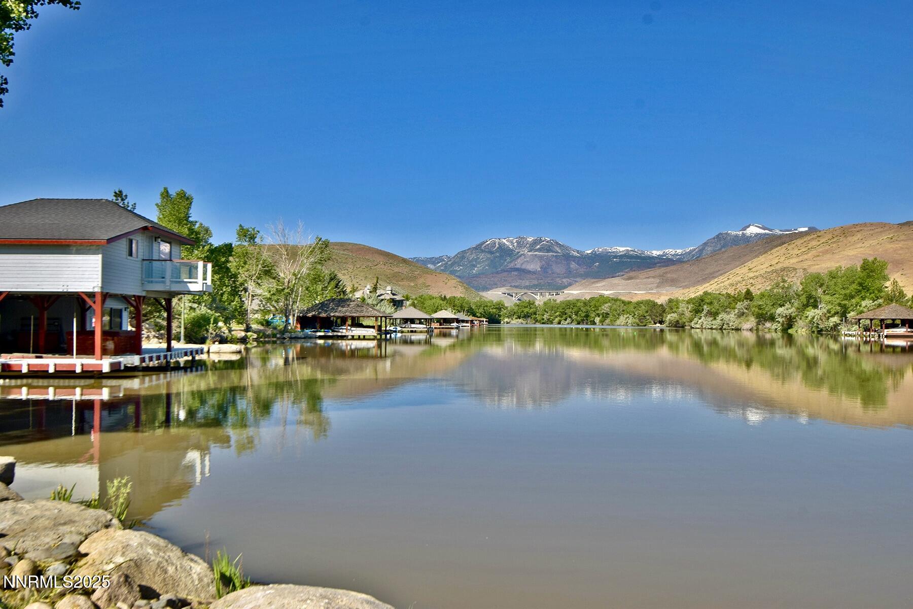 95 Hidden Lake Drive Reno, NV 89521 - Photo 3 of 43 a view of a lake with houses