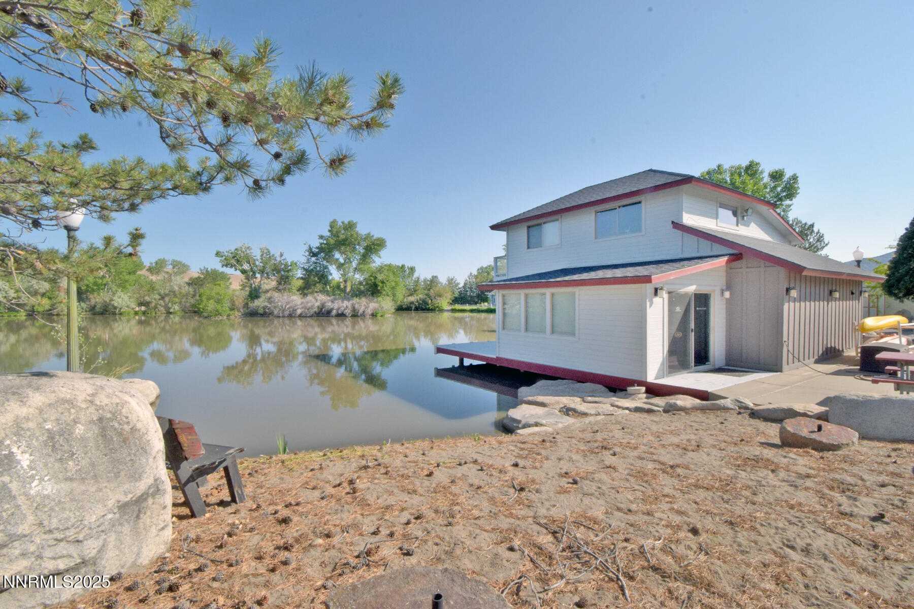 95 Hidden Lake Drive Reno, NV 89521 - Photo 34 of 43 a front view of a house with a yard and a pond