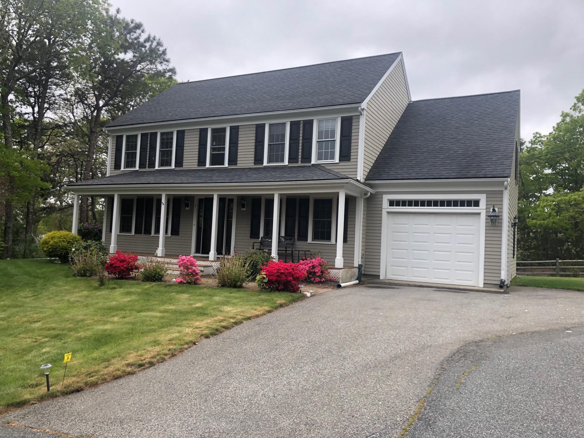 front view of a house with a yard
