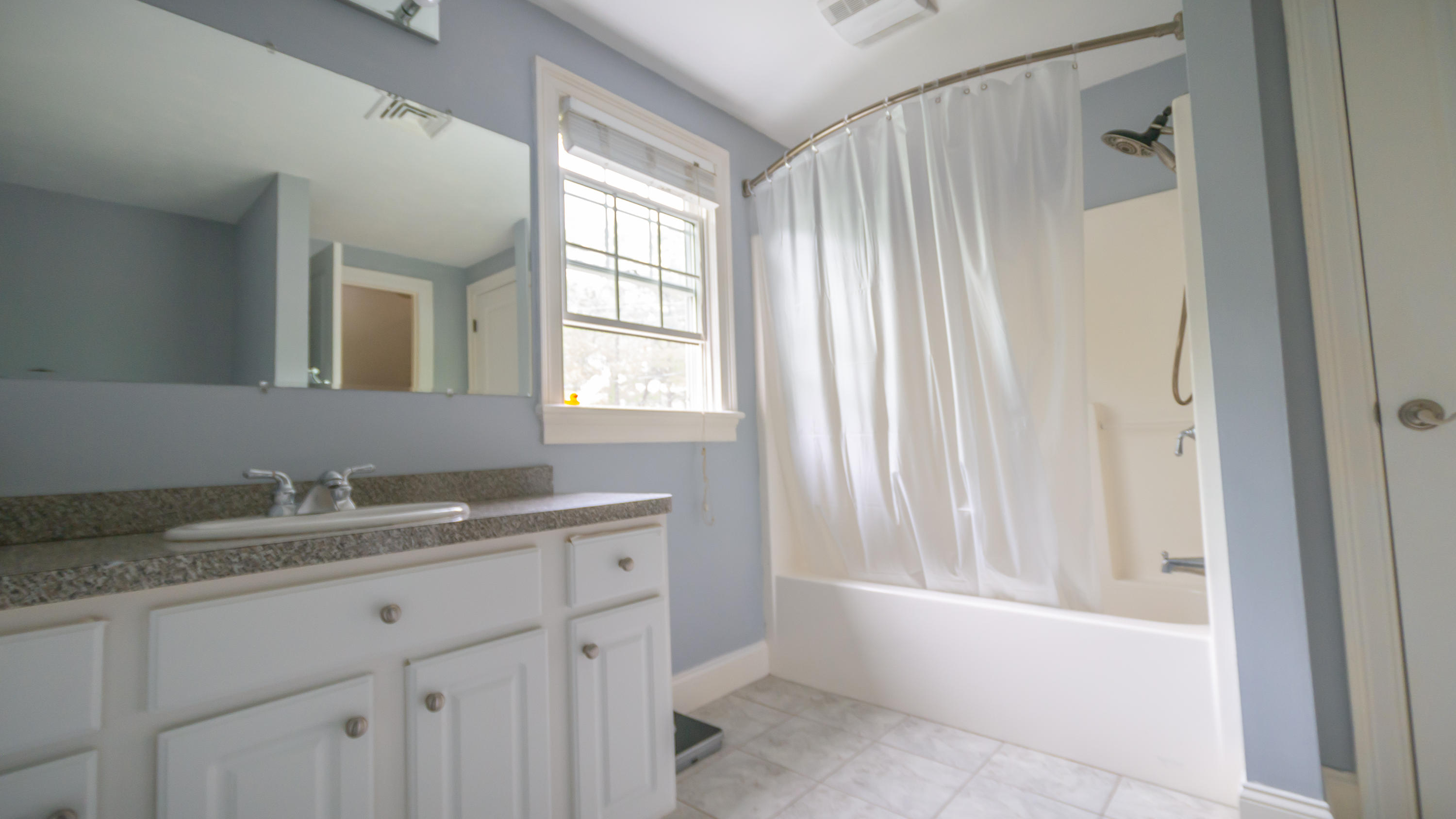7 Webquish Lane Mashpee, MA 02649 - Photo 11 of 29 a bathroom with a granite countertop sink and a mirror