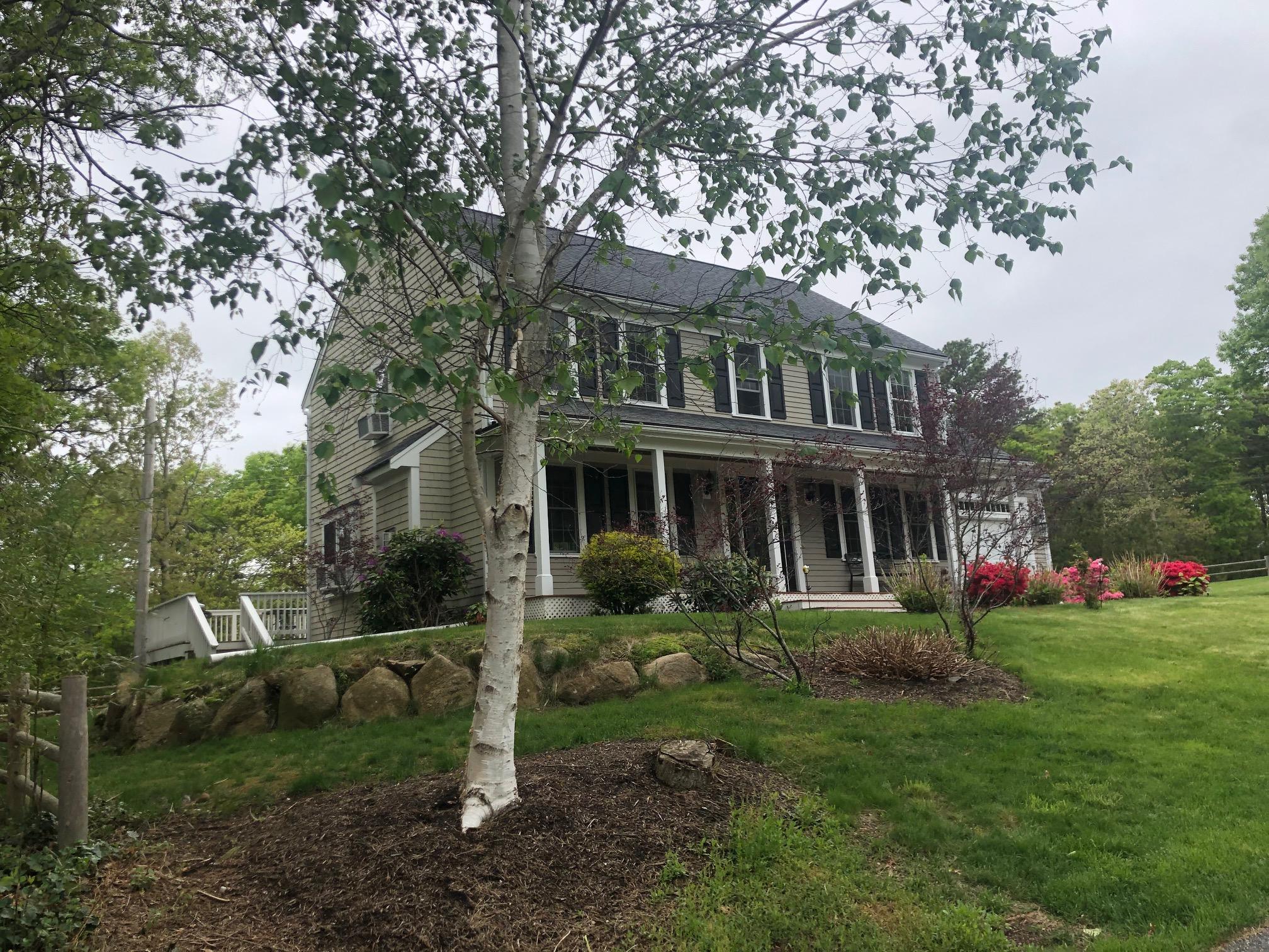 7 Webquish Lane Mashpee, MA 02649 - Photo 2 of 29 a front view of house with a garden