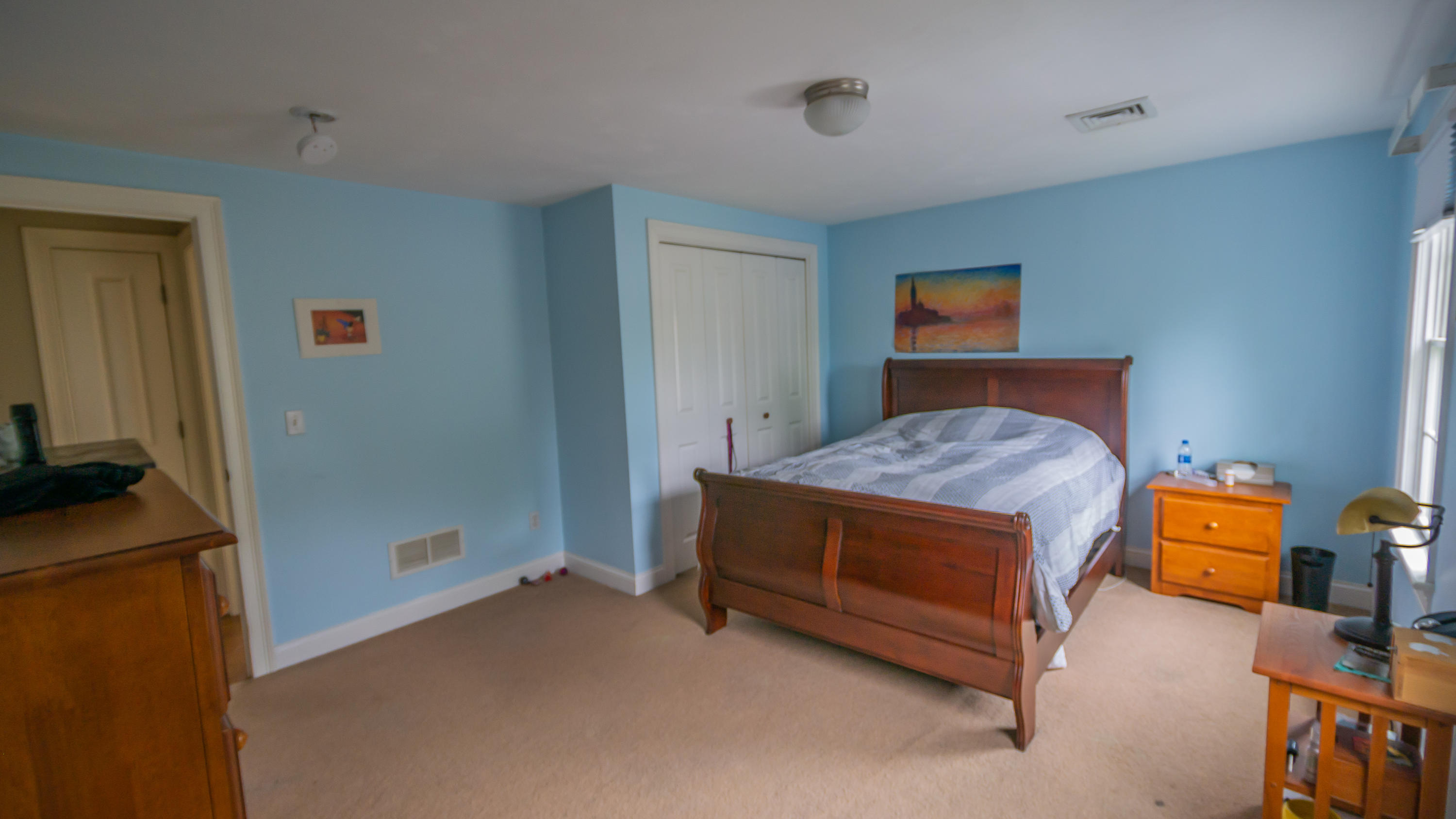 7 Webquish Lane Mashpee, MA 02649 - Photo 24 of 29 a bedroom with a bed and a flat tv screen on the wall