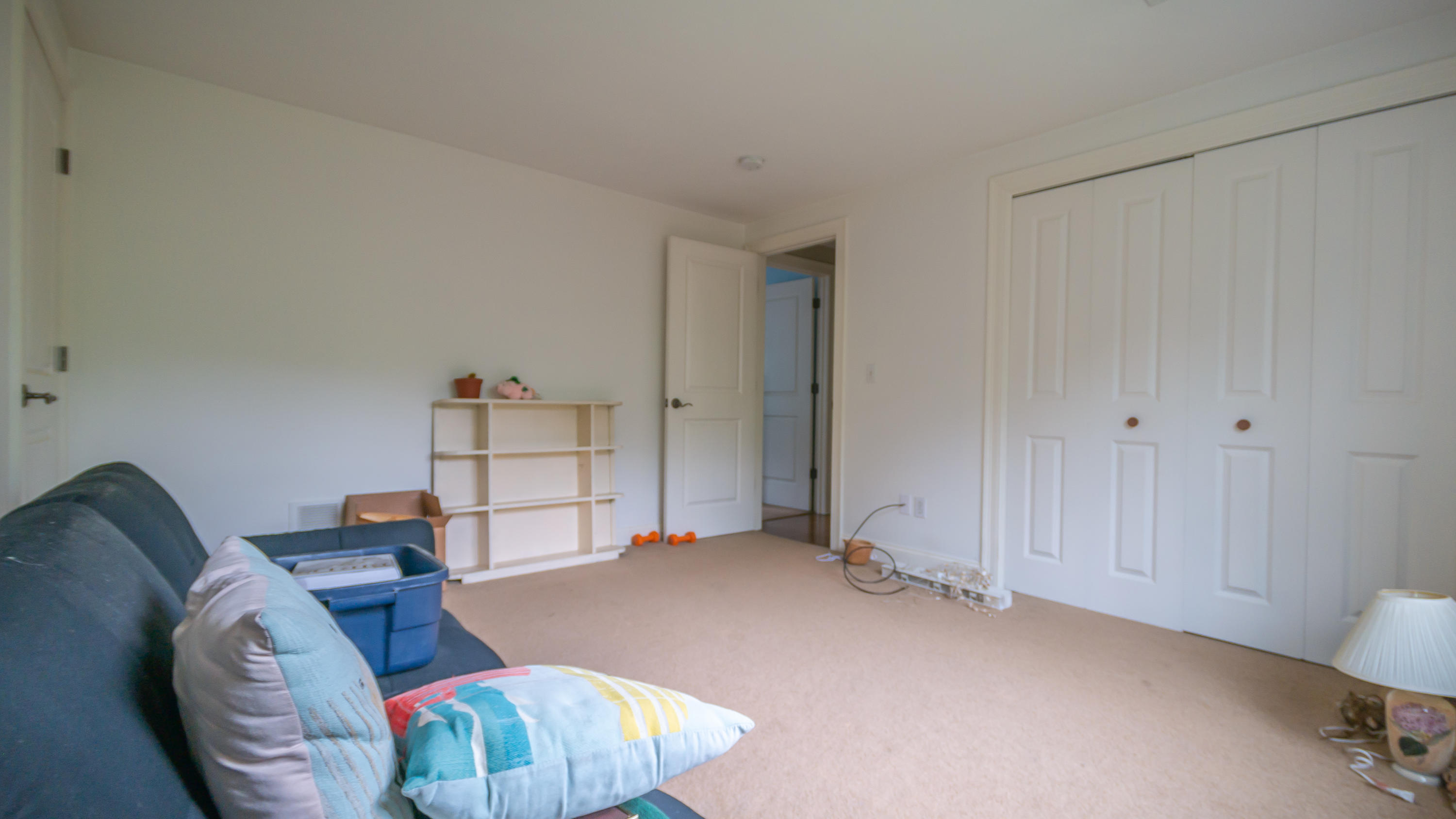 7 Webquish Lane Mashpee, MA 02649 - Photo 28 of 29 a bedroom with furniture and a chandelier