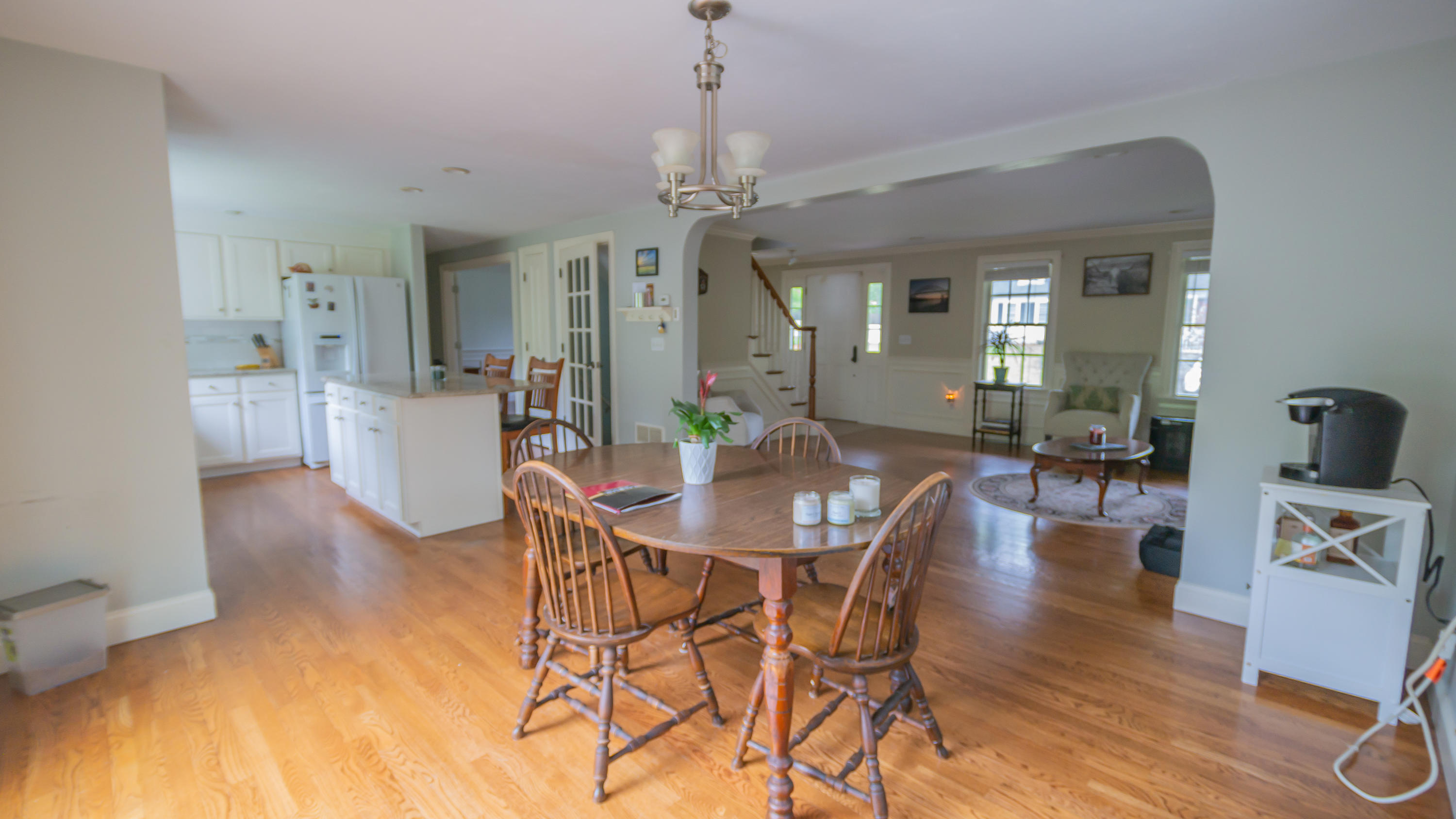 7 Webquish Lane Mashpee, MA 02649 - Photo 6 of 29 a view of a dining room with furniture wooden floor and a chandelier