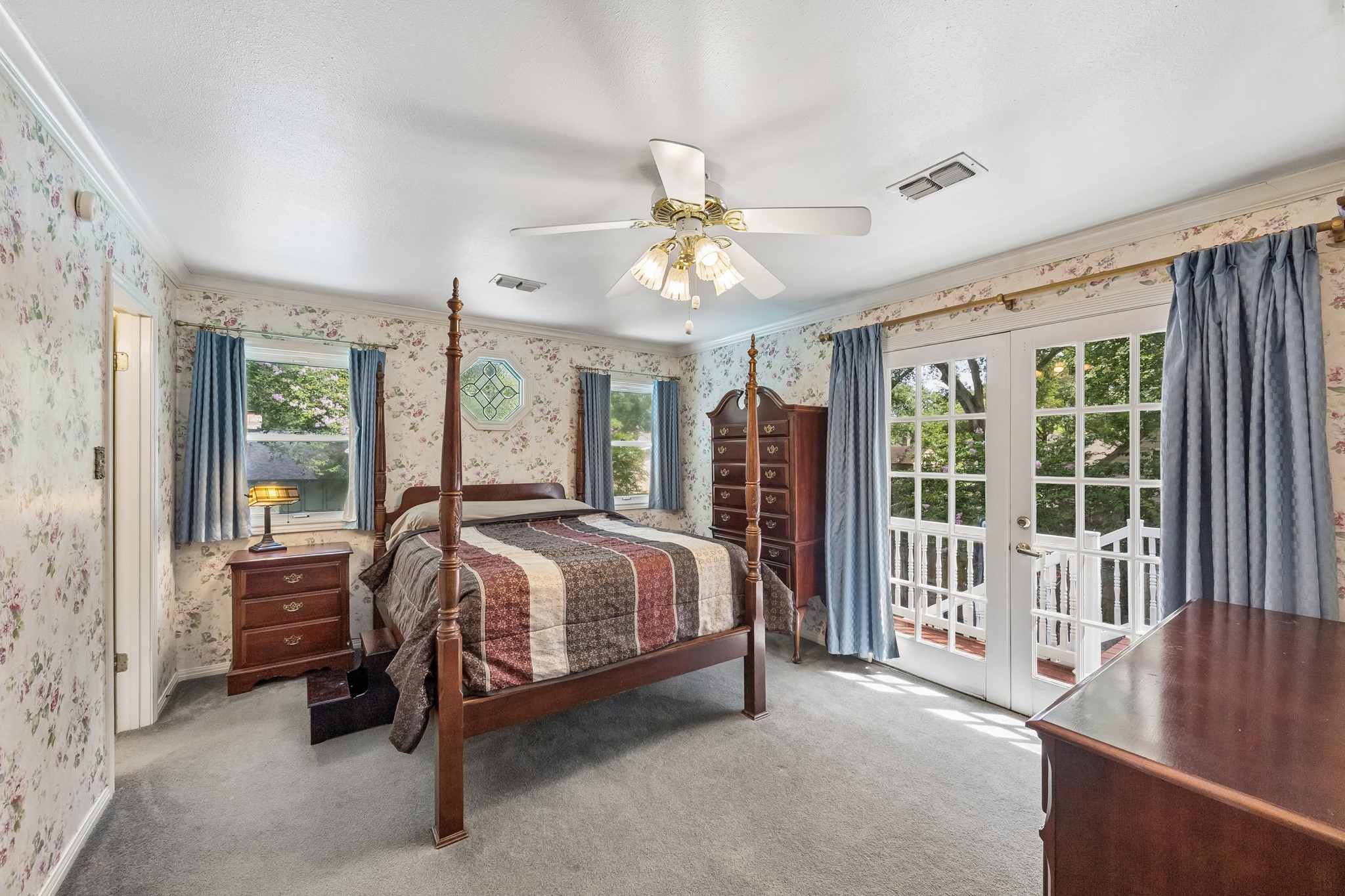 1003 Eagle Lake Road Sealy, TX 77474 - Photo 6 of 17 Spacious primary bedroom with French doors that lead to the upstairs patio