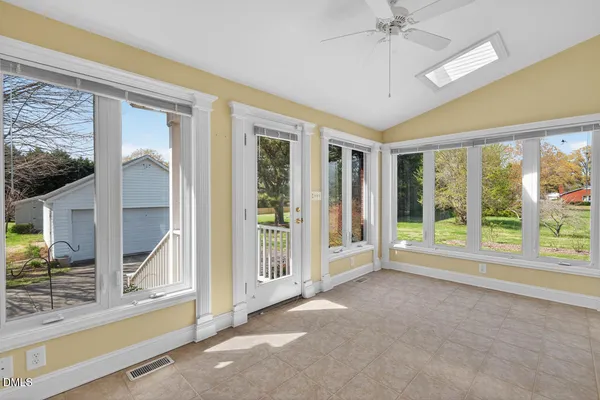 a view of an empty room with a window