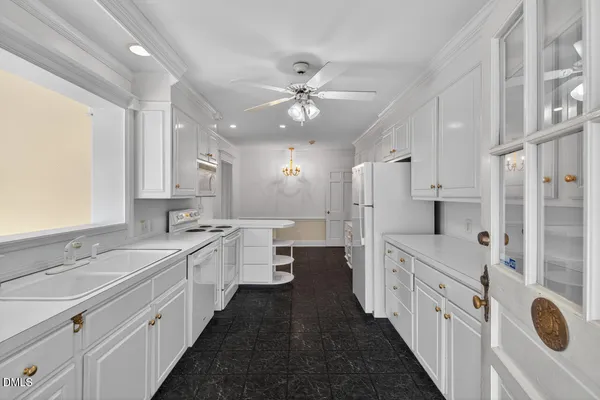 a large kitchen with a lot of counter space and a sink