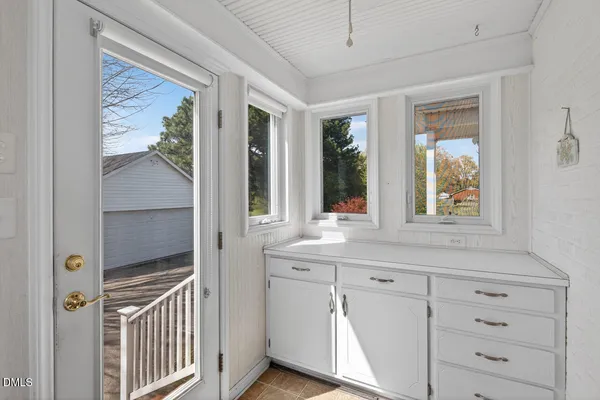 a view of a door and a window