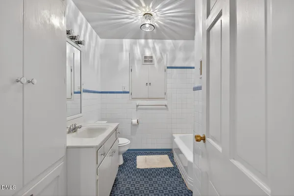 a bathroom with a white bathtub