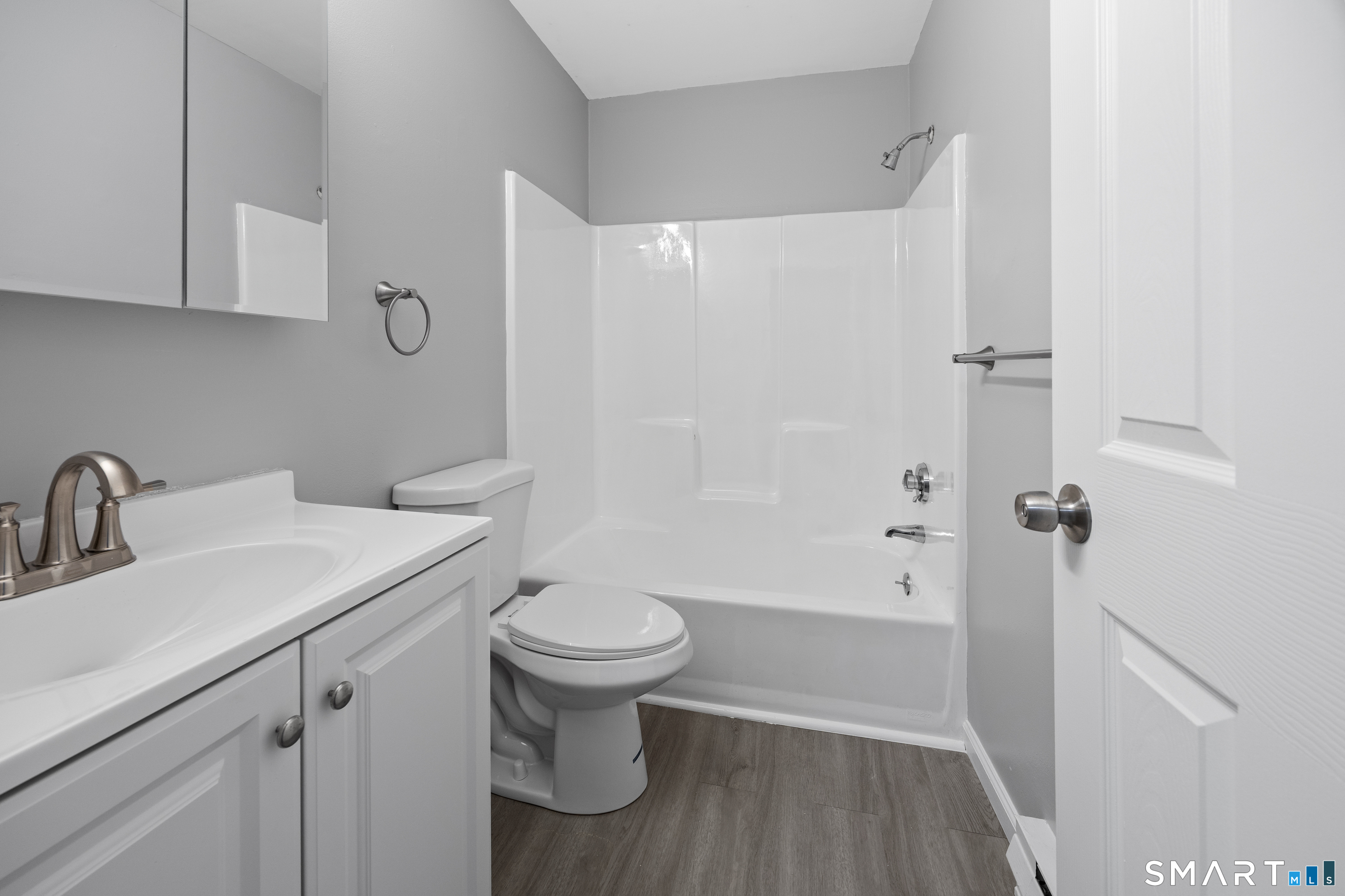 36 Sharon Road, Unit 11 Waterbury, CT 06705 - Photo 8 of 13 a bathroom with a sink toilet and shower