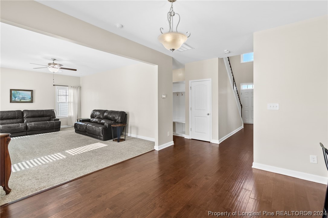 6817 Hunters Den Road Hope Mills, NC 28348 - Photo 17 of 49 a bed room with furniture and wooden floor