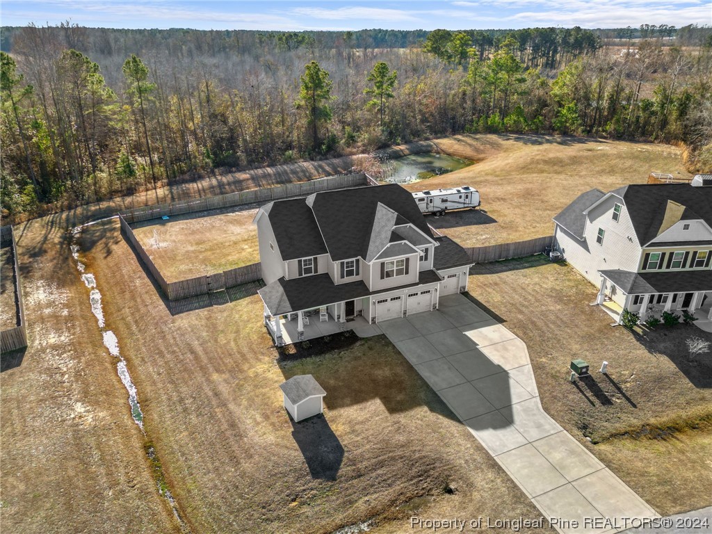 6817 Hunters Den Road Hope Mills, NC 28348 - Photo 2 of 49 a view of a swimming pool with lawn chairs