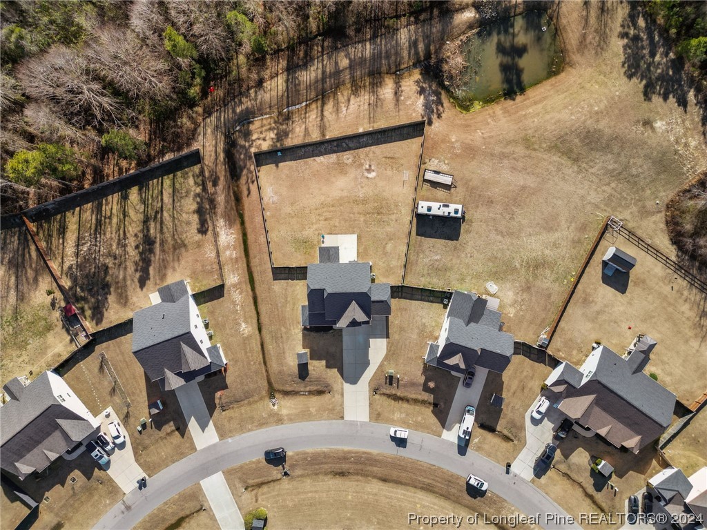 6817 Hunters Den Road Hope Mills, NC 28348 - Photo 3 of 49 an aerial view of a house with outdoor space