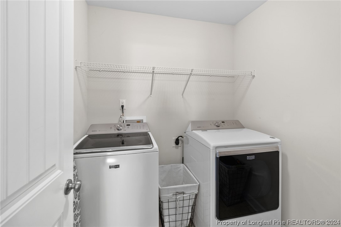 6817 Hunters Den Road Hope Mills, NC 28348 - Photo 31 of 49 a utility room with dryer and washer