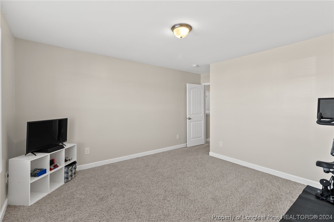 6817 Hunters Den Road Hope Mills, NC 28348 - Photo 39 of 49 a view of room with flat screen tv and a window