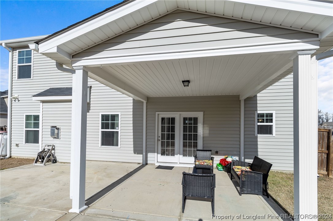 6817 Hunters Den Road Hope Mills, NC 28348 - Photo 41 of 49 a outdoor space with patio furniture and potted plants