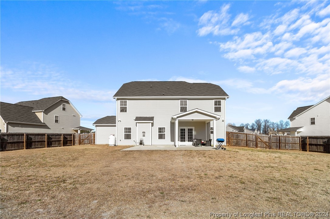 6817 Hunters Den Road Hope Mills, NC 28348 - Photo 43 of 49 a front view of a house with a large tree