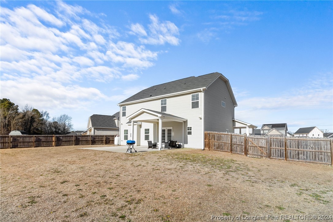 6817 Hunters Den Road Hope Mills, NC 28348 - Photo 44 of 49 a front view of a house with a yard