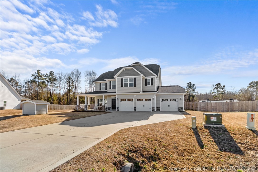 6817 Hunters Den Road Hope Mills, NC 28348 - Photo 48 of 49 a view of a house with a outdoor space
