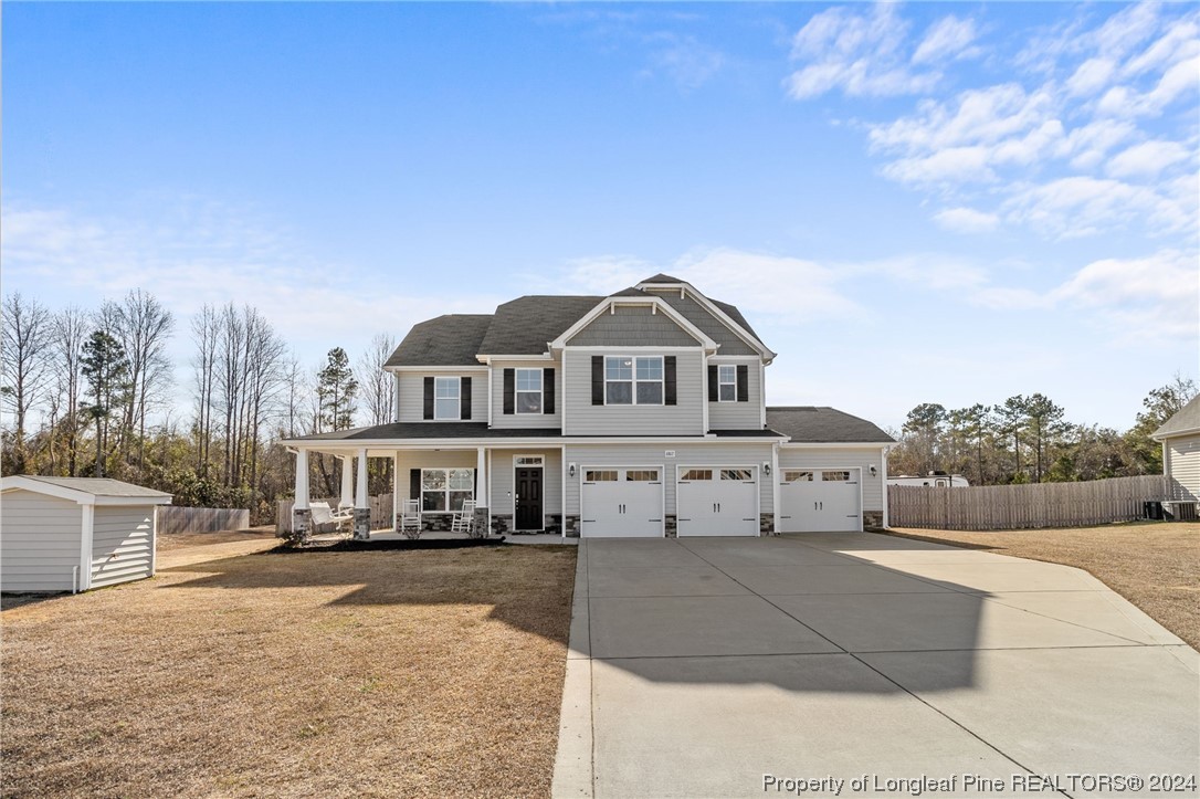 6817 Hunters Den Road Hope Mills, NC 28348 - Photo 49 of 49 a front view of a house with a yard