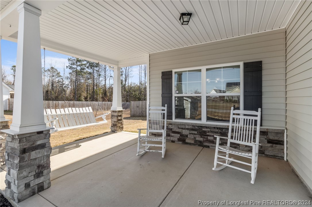 6817 Hunters Den Road Hope Mills, NC 28348 - Photo 5 of 49 a view of a chairs and table in the balcony