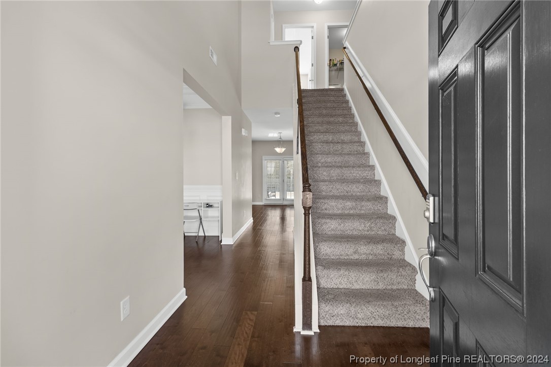 6817 Hunters Den Road Hope Mills, NC 28348 - Photo 6 of 49 a view of entryway and hall with wooden floor