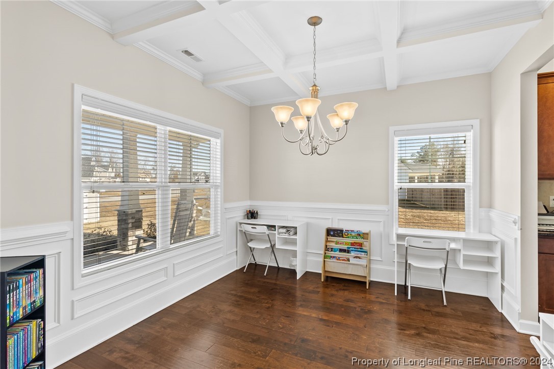 6817 Hunters Den Road Hope Mills, NC 28348 - Photo 7 of 49 a living room with furniture and a chandelier