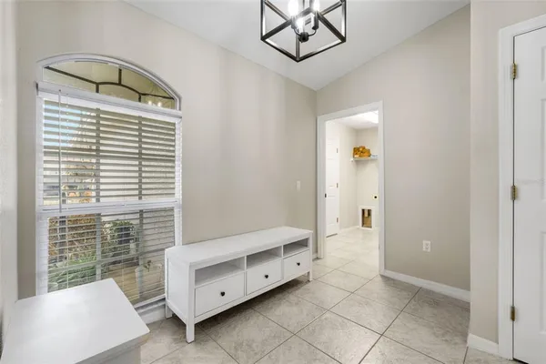 a spacious bedroom with a bed and a window