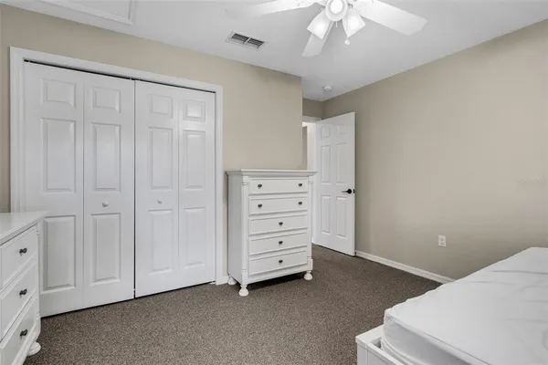 a view of an empty room with a cabinet