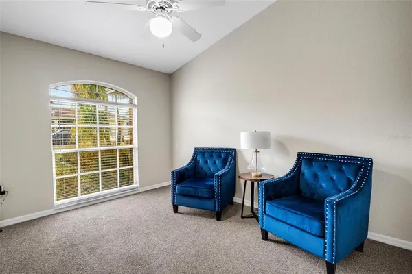 a living room with furniture and a window