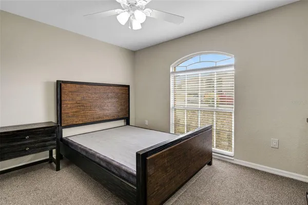 a bed room with a bed and a window