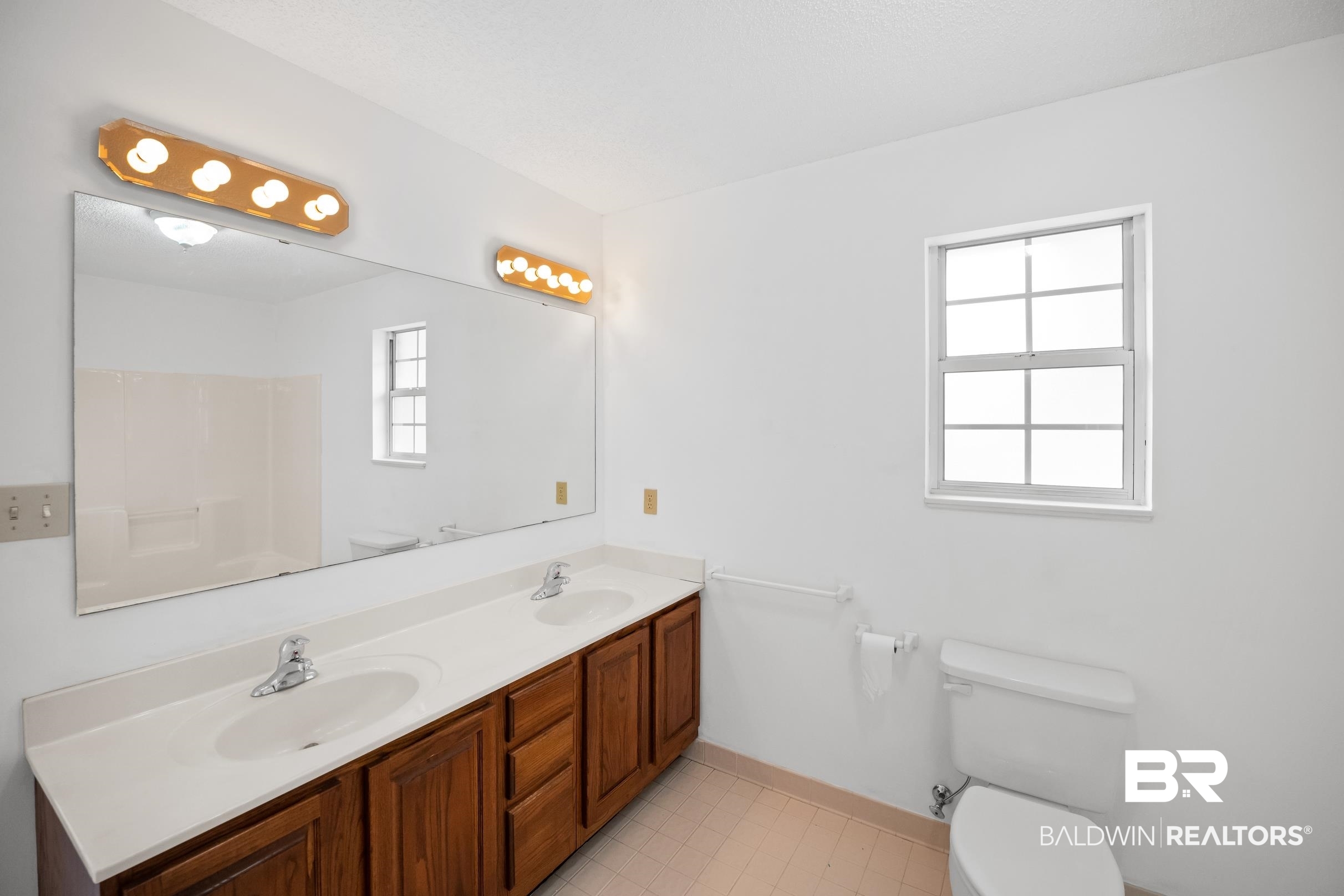 2673 Pine Ridge Drive Lillian, AL 36549 - Photo 16 of 38 Full bathroom with toilet, a wealth of natural light, and a sink