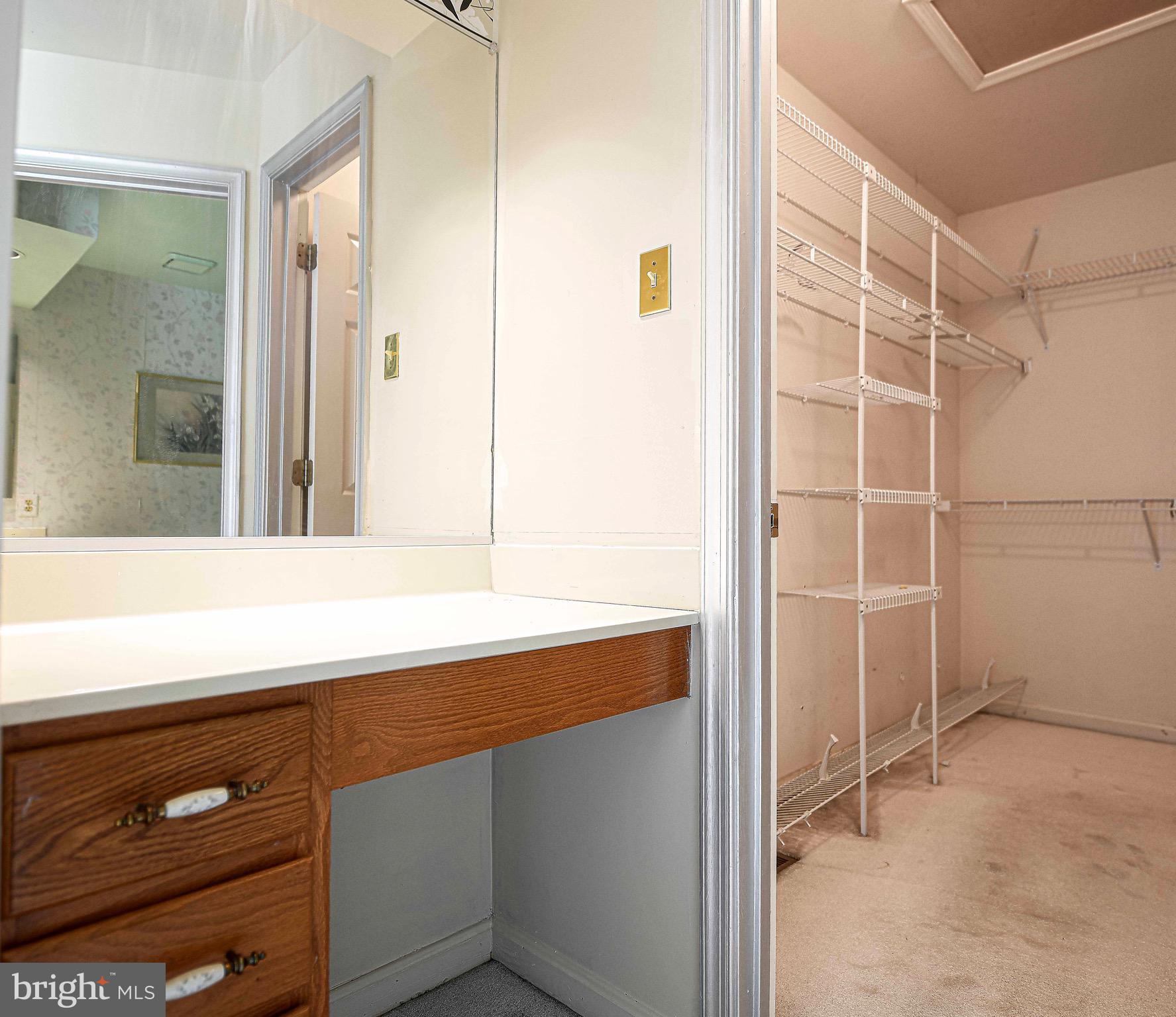 8819 Falcon Ridge Drive Randallstown, MD 21133 - Photo 21 of 38 Vanity and Walk-in Closet in Primary Bedroom