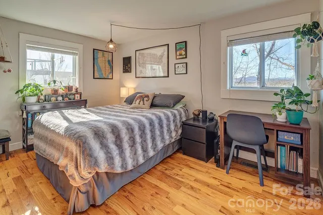 a bedroom with a bed and a chair