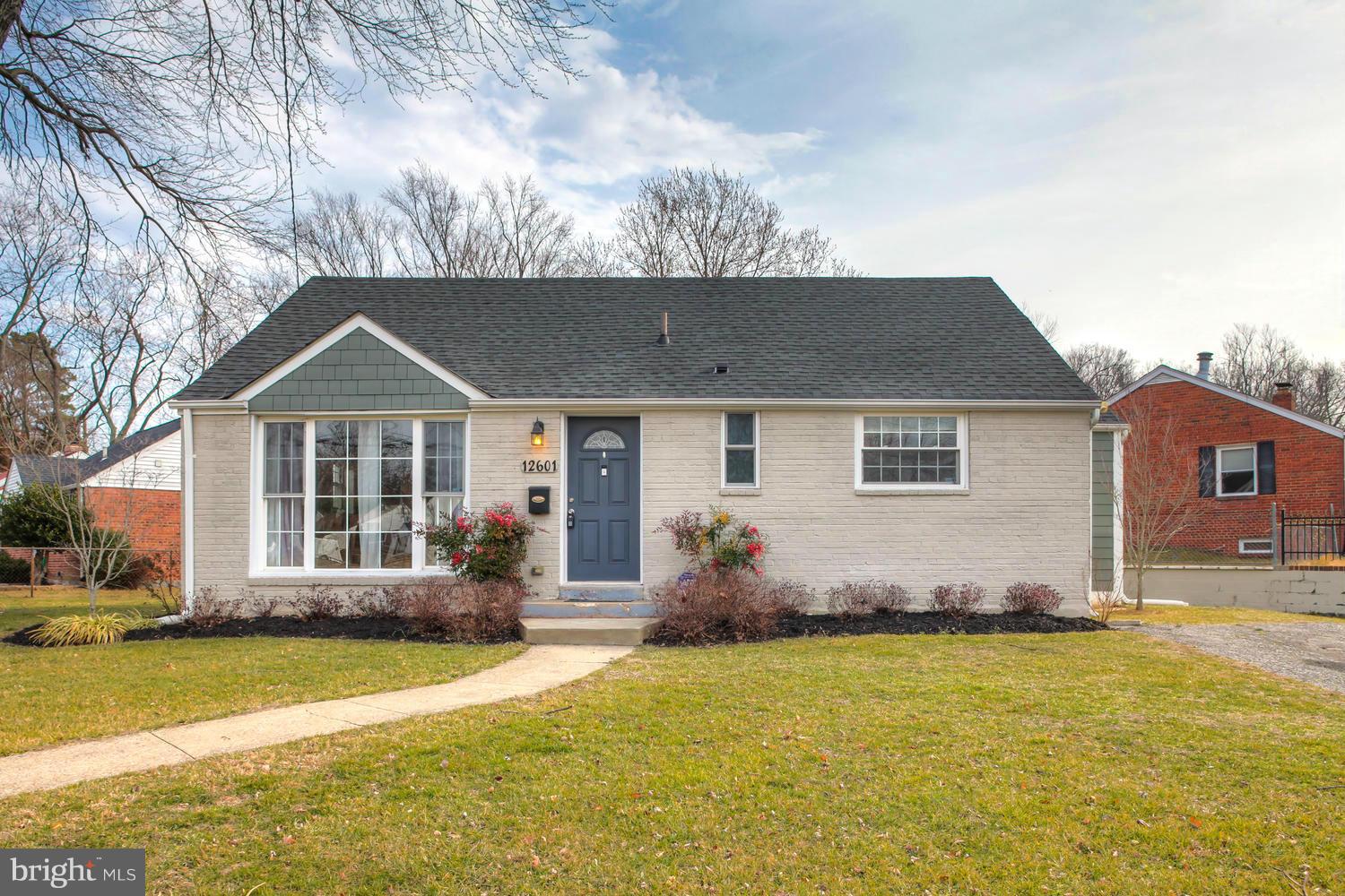 12601 Denley Road Silver Spring, MD 20906 - Photo 1 of 30 a front view of a house with a yard
