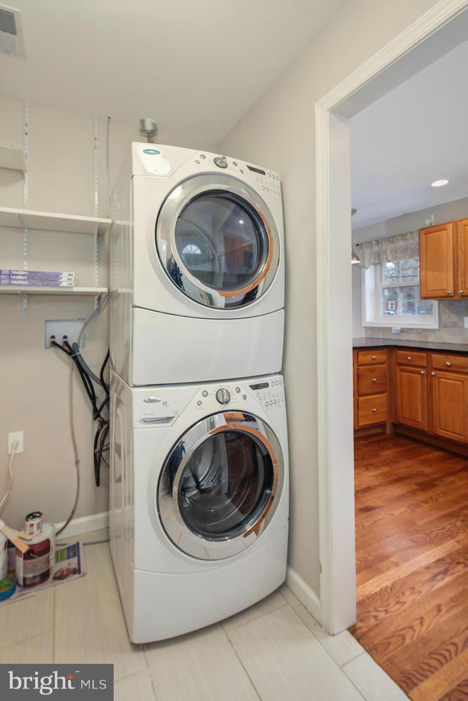 12601 Denley Road Silver Spring, MD 20906 - Photo 14 of 30 a view of a storage and utility room with washer and dryer
