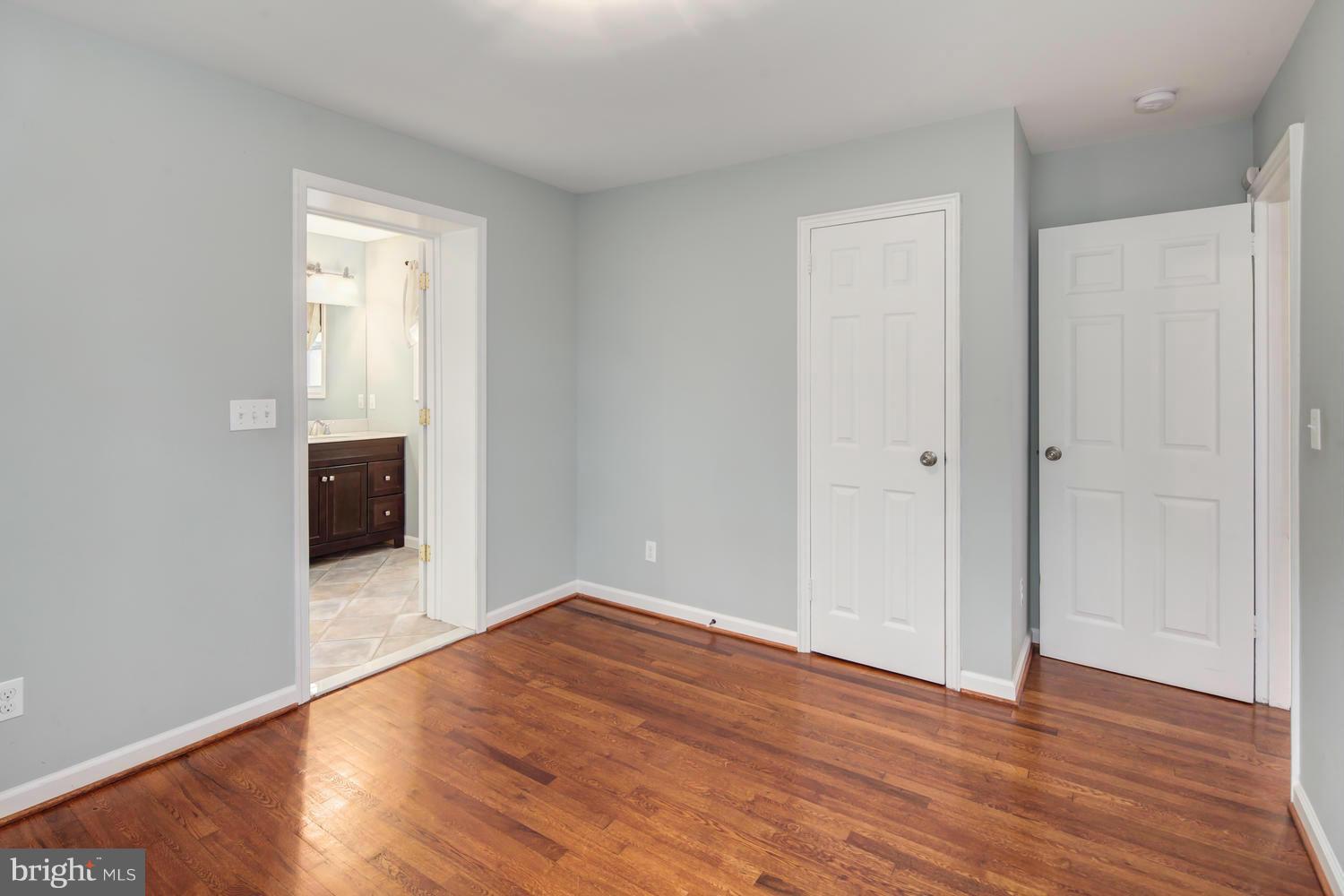 12601 Denley Road Silver Spring, MD 20906 - Photo 16 of 30 a view of empty room with wooden floor and fireplace