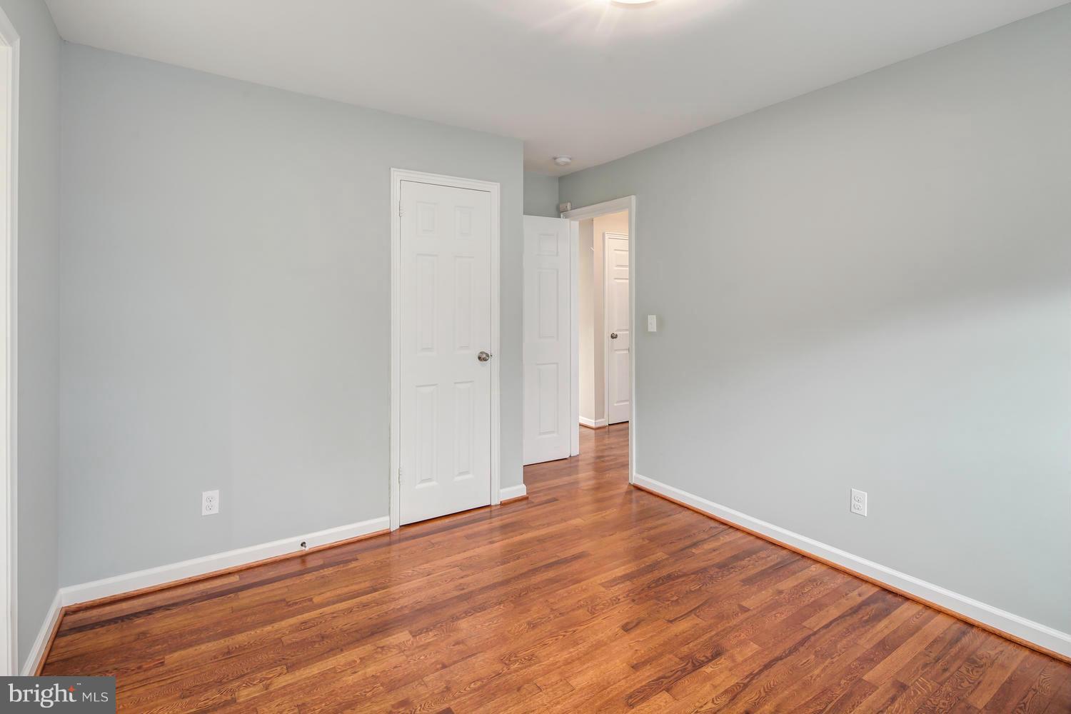 12601 Denley Road Silver Spring, MD 20906 - Photo 17 of 30 a view of an empty room with wooden floor