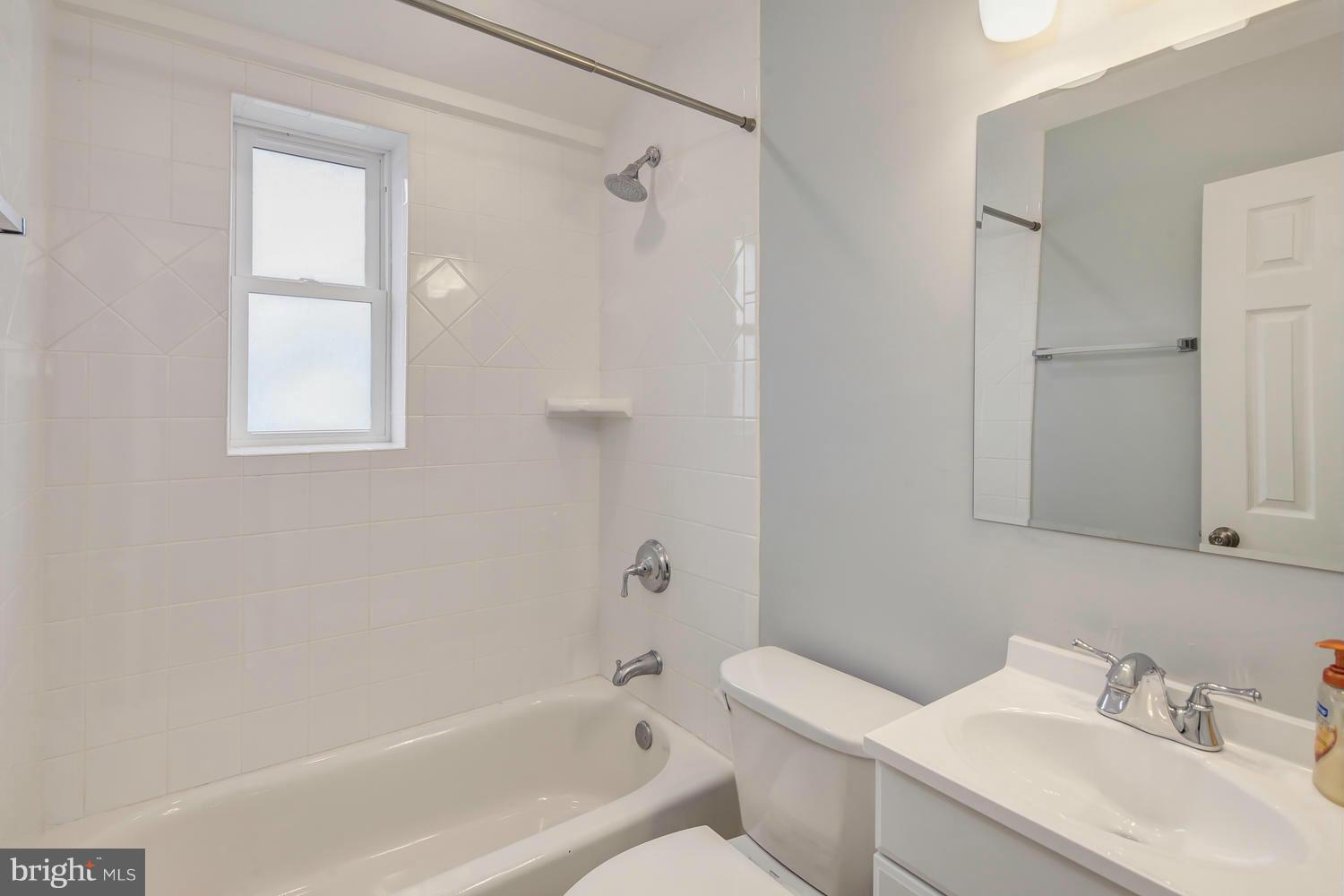12601 Denley Road Silver Spring, MD 20906 - Photo 24 of 30 a bathroom with a sink toilet and shower