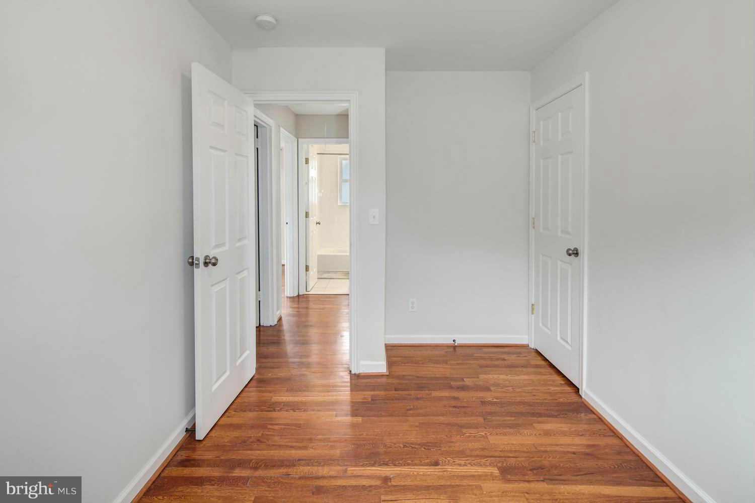 12601 Denley Road Silver Spring, MD 20906 - Photo 25 of 30 a view of a hallway with wooden floor