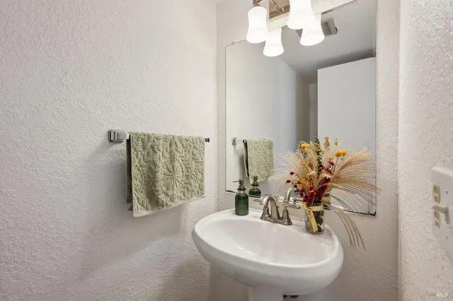 a dining room with furniture a window and a chandelier