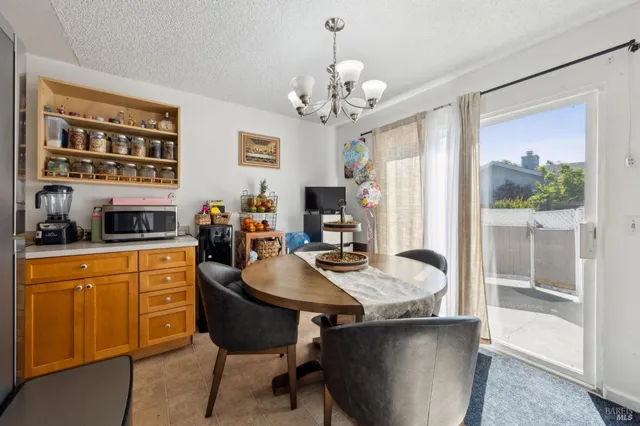 a living room with dining table