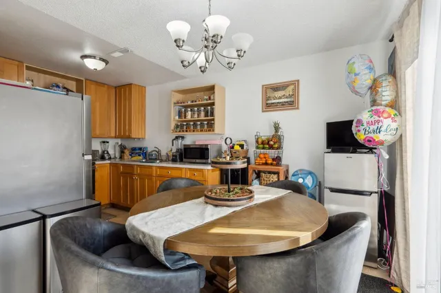 a view of a dining room with furniture window and outside view