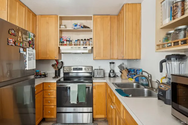 a kitchen with a stove and a microwave