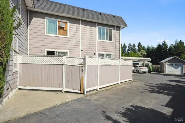 a view of a house with a parking space