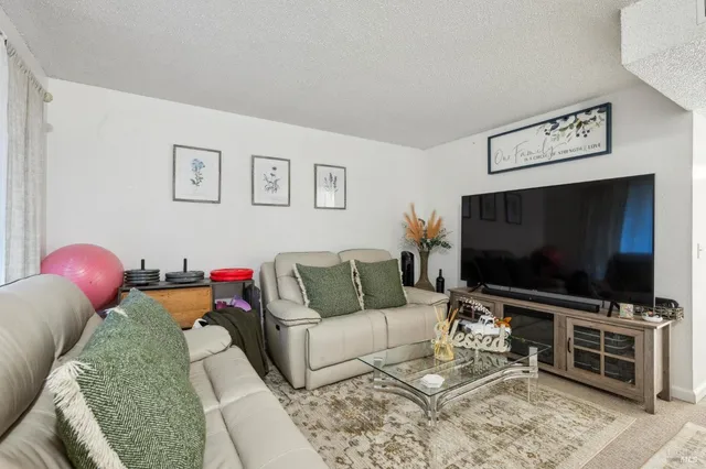 a living room with furniture and a couch