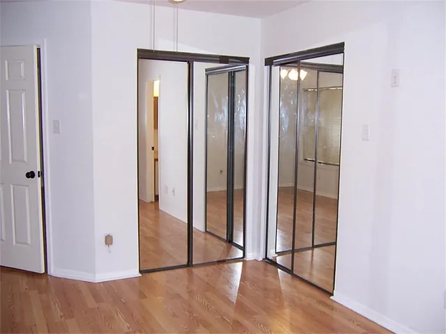 a view of entryway with wooden floor