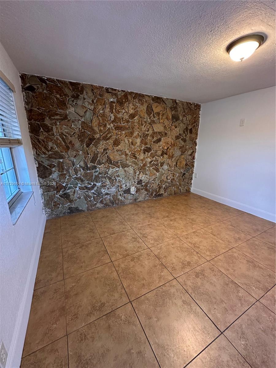 6131 Southwest 39th Street, Unit EAST Miramar, FL 33023 - Photo 1 of 15 a view of an empty room